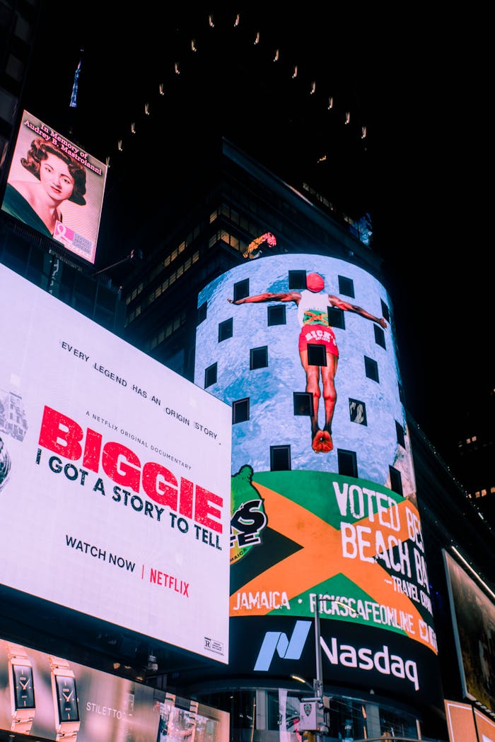 Vibrant billboards light up Times Square, showcasing advertisements in New York City.